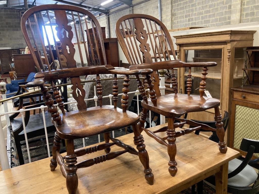 A near pair of 19th century ash and elm Yorkshire Windsor armchairs, larger width 63cm, depth 48cm, height 114cm